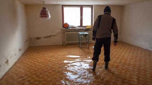 inspecting-flood-damaged-house