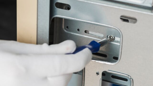 male-technician-fixing-screw-computer-slot_23-2147922374